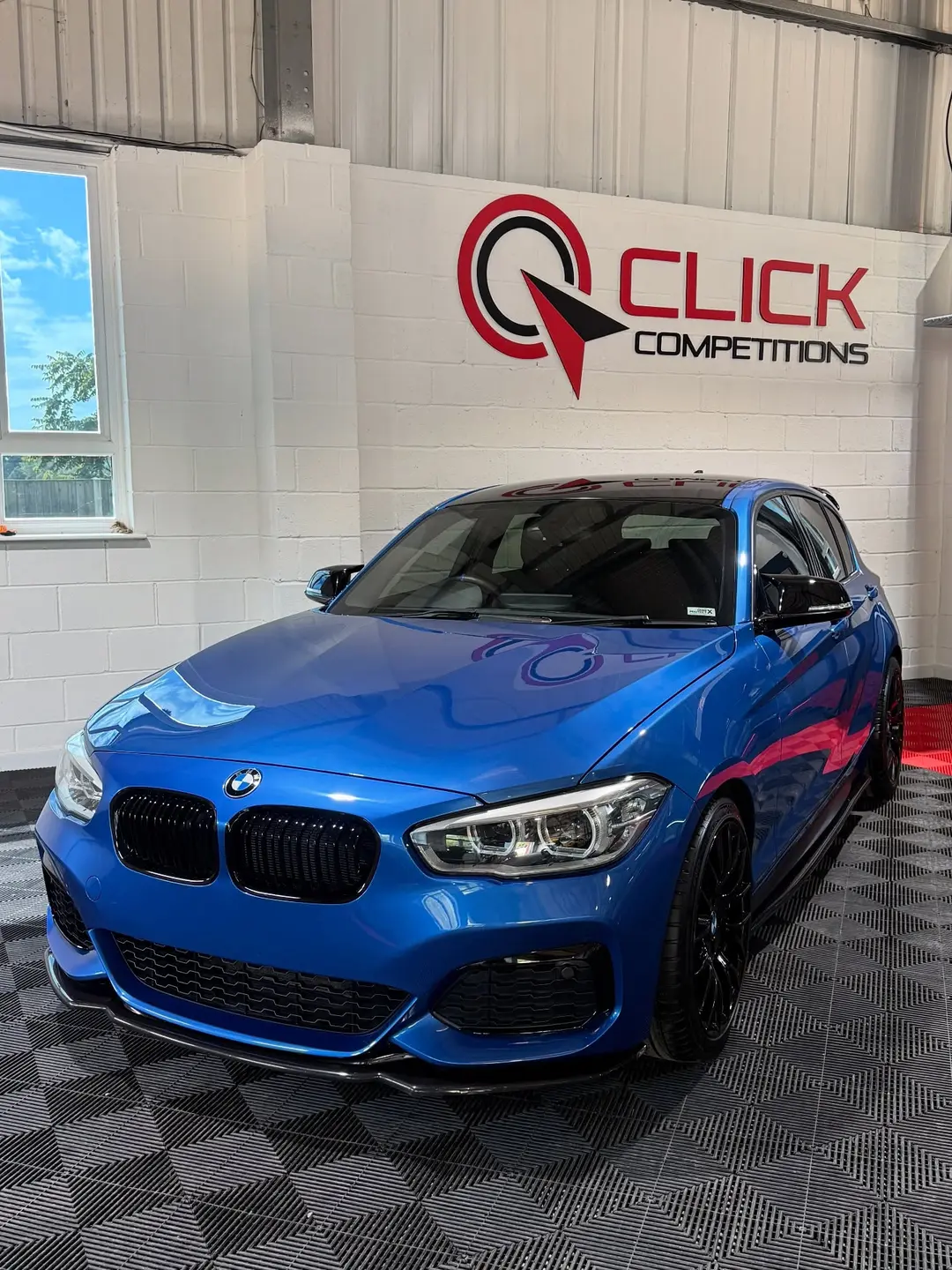 Blue BMW 1 Series valeted for a Norfolk competitions business